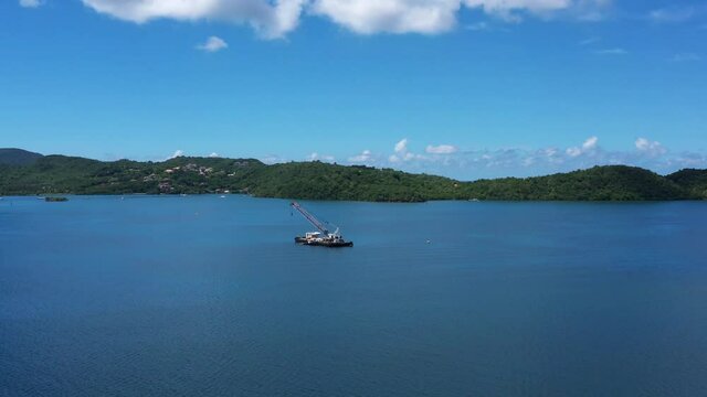 Dredging machine in Martinique Fort de France bay aerial view sunny day 
 