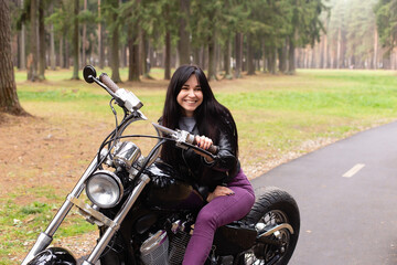 Happy girl on a motorcycle