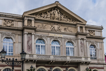 Obraz premium View of Baden-Baden Theater (1862) building. Baden-Baden Theater - neo-baroque white-and-red sandstone building. Baden-Baden, Germany.