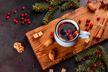 Obraz na płótnie Canvas Hot mulled wine for winter and Christmas with various spices