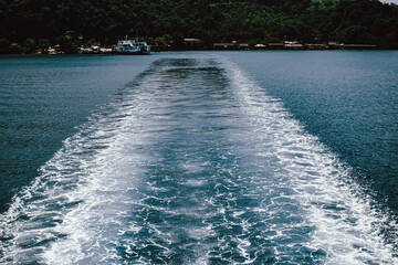 Waves on blue sea behind the ship, sea affect the boat, Boat Wave.