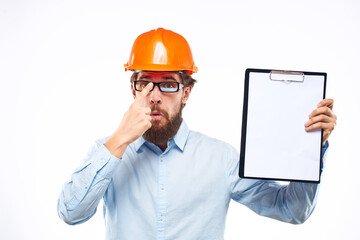 Business man construction hard hat with professional industry documents