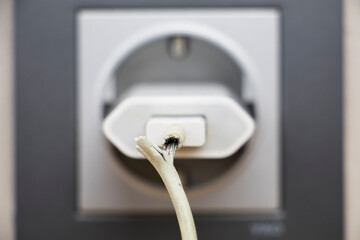 close up photo of damaged charging cable. technological concept image