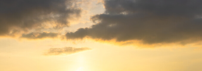 Evening sky with a dark cloud in calm warm tones