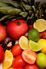 Naklejka na ściany i meble Healthy fruits and vegetables on white background