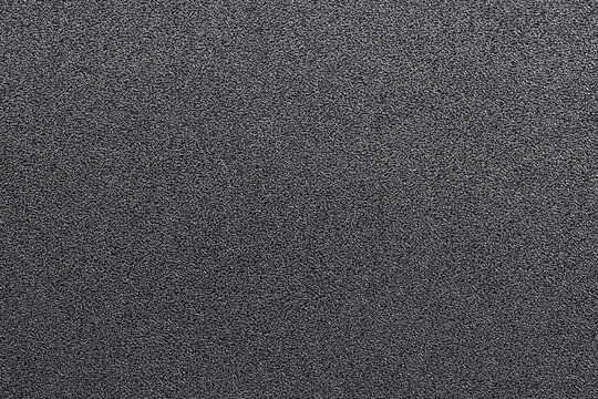 Black  hard plastic material with rough pressing texture. Hard grey texture. Metal hoarfrost texture.
