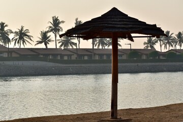 Beach umbrella on the sand beach, Jeddah, Saudi Arabia