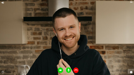 A desktop computer screen view of the telecommunications application during a video chat on which the team lead is listening to employees a reportage about a business from home.