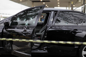 Bullet holes are seen in the window of a car after a armed robbery shot in Sao Paulo, Brazil.
