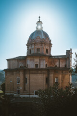 Fototapeta na wymiar Church of Santi Martina e Luca with the sun illuminating the dome lantern