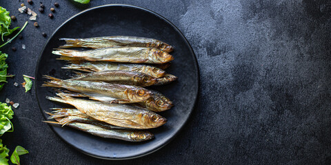 sardines sprats smoked or salted fish seafood mackerel meal on the table tasty serving size top...