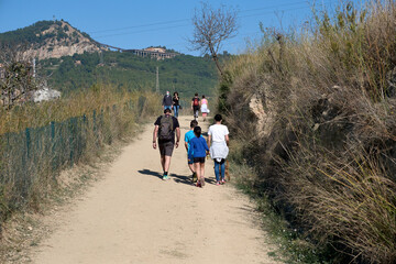 Spain, Barcelona, ​​10-31-2020. Families walk in the mountains escaping from the covid-19 virus