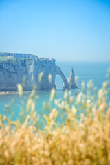 The chalk cliffs in Etretat in french Normandy, atlantic coast of France. Summer view of atlantic ocean.