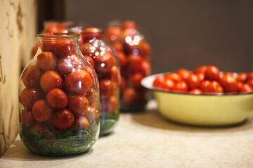 Preparing tomatoes for conservation in glass jars. Pickled tomato in glass jar. Glass jar with tomatoes.