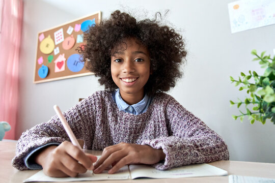 Happy African American Kid Child Girl School Student Looking At Web Cam Talking With Remote Teacher Distance Learning Video Conference Call Virtual Class Lesson, Headshot Zoom Portrait, Webcam View.