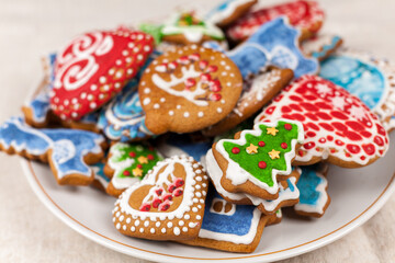 Obraz na płótnie Canvas Christmas cookies, Christmas homemade cakes, holiday cookies in the form of Christmas trees, winter landscapes, preparing for a family dinner, home-made treats