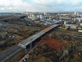 Aerial view of the construction of an automobile bridge over the railway (Kirov, Russia).