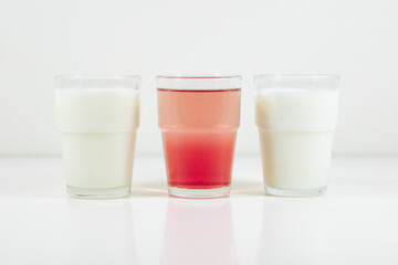 Glasses of lemonade in colors representing flag of Japan. It is a photo in a series of similar photos perfect to use in a quiz.