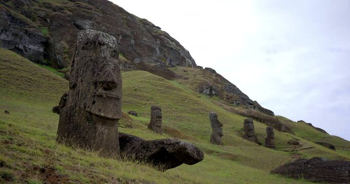 Easter Island heads near mountain, low angle