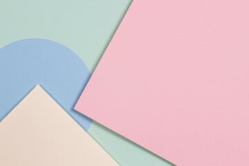 Abstract geometric texture background of fashion soft green, pastel pink, light blue, yellow color paper. Top view, flat lay