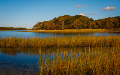 Fototapeta premium Autumn Golden Hour Seascape of Island over the Marsh Grasses on Cape Cod