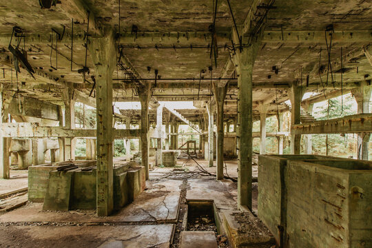 View of abandoned empty buildings of old tin mine. Industrial dirty building interior. Damaged factory in Rolava, Ore mountains,Czech republic