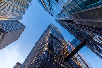 Keuken spatwand met foto Office buildings stretch up to the blue sky in the financial district in downtown Toronto Canada. © Ken
