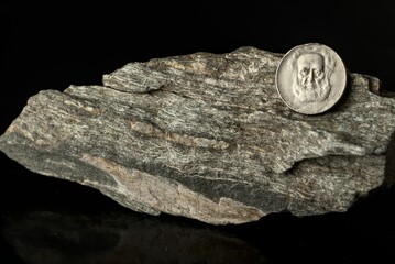 old coins isolated on black