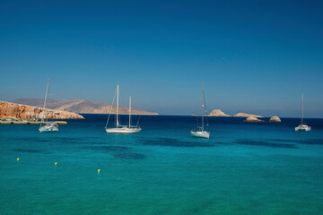 View over Karavostasis bay and sailboats at Folegandros island, Greece