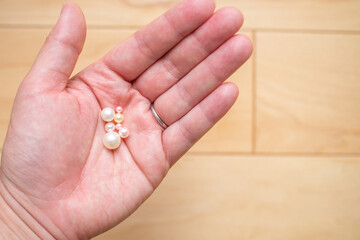 Photo of holding handmade accessory parts by hand