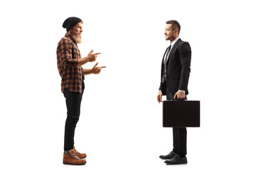 Bearded guy standing and talking to a businessman in a black suit
