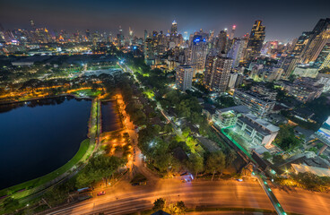 Obraz premium Panoramic View of Bangkok, Thailand. Cityscape with Public Park and Skyscrapers at Night