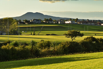 AUCKLAND, NEW ZEALAND - Apr 10, 2019: Macleans College grounds with houses and Rangitoto volcanic...