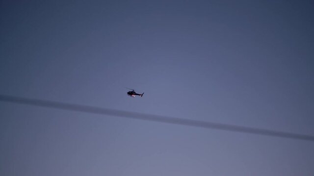 911 Police chopper searching for suspect at twilight in Los Angeles