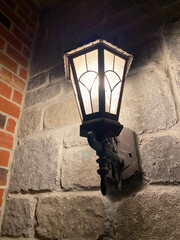 lamp post on the brick wall of a house, lantern