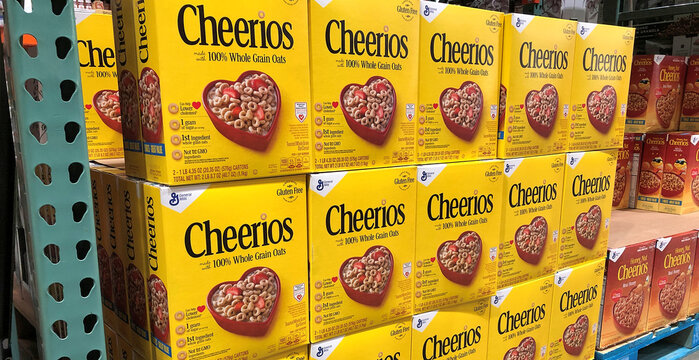 BAXTER, MN - 8 DEC 2019: Cheerios cereal boxes on display in a store. General Mills manufactures and markets branded consumer foods.