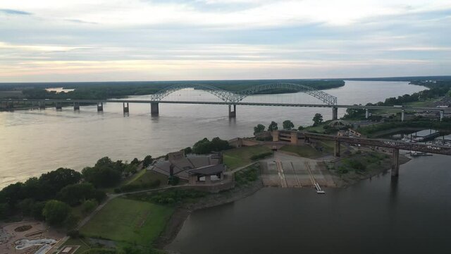 Aerial View of Hernando de Soto Bridge Above Mississippi River Between Tennessee and Arkansas States, Memphis USA. Landmark on Summer Sunset Sunlight, Drone Shot