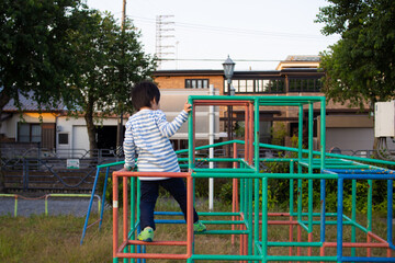 Japanese kindergarten children playing in a jungle gym in a park in Gifu City, Gifu Prefecture