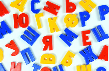   background of colored letters of the Russian alphabet in a chaotic order       