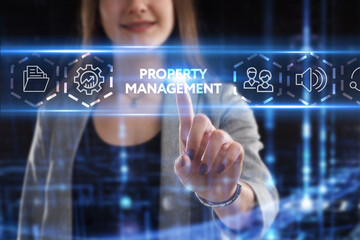 Business, Technology, Internet and network concept. Young businessman working on a virtual screen of the future and sees the inscription: Property management