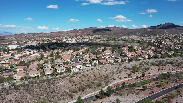 HD drone footage of residential neighborhood near McDonald Ranch area of Henderson, NV, no people, clouds, landscape, aerial view of vegas