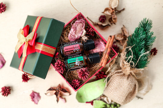 Mudgee, New South Wales / Australia - November 1 2020:  Doterra essential oil illustrative product image in Christmas setting, Holiday Peace and Harvest Spice