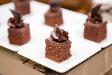 Selective focus of Many chocolate cakes  on the shelves