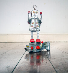 silver robot standing on top