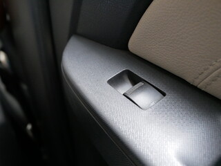 electric window switch button for adjustable folding in a modern car.