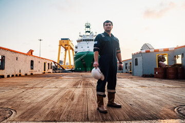 Marine Deck Officer or Chief mate on deck of offshore vessel or ship , wearing PPE personal...