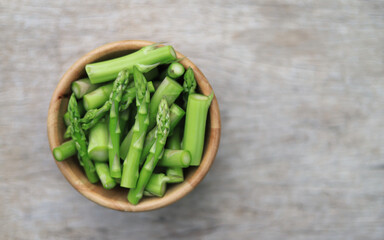asparagus freesh cutting in wood for being in gredient in cooking 