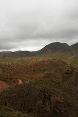 High in the Andes mountains. Beautiful view of the red and green hills in the popular landmark Miranda Slope in La Rioja, Argentina.