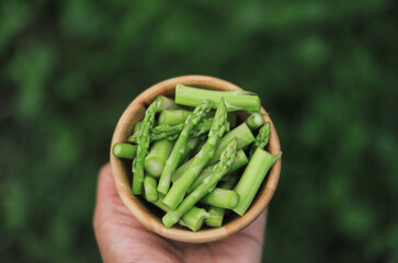 asparagus freesh cutting in wood for being in gredient in cooking 