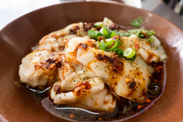 spicy wontons on a bowl
